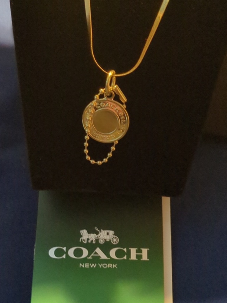 Coach Gold-Tone Round Pendant Necklace With Charm 69$